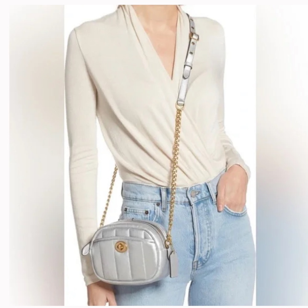 Coach metallic silver quilted crossbody bag.